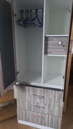 a white cabinet with drawers and a shelf at Cuarto por candelaria 2026 in Puno