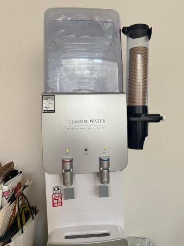 a parazonian water espresso machine sitting on a counter at any one in Chitose