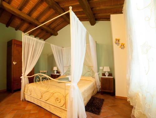 Posteľ alebo postele v izbe v ubytovaní Agriturismo Podere il Corniolino
