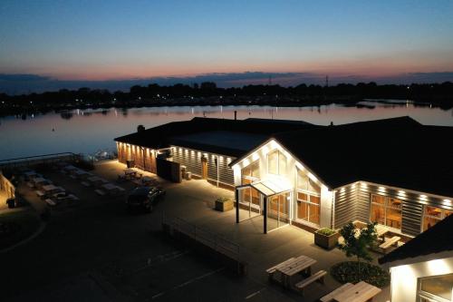an aerial view of a building next to a body of water at Unity Seven Lakes in Crowle