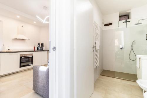 a bathroom with a shower and a toilet and a sink at La Casa sulla Cascata in Colonno