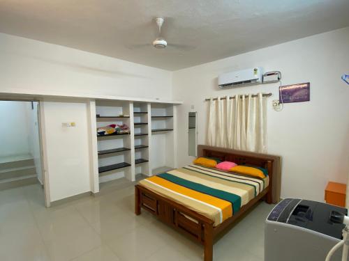 a bedroom with a bed in a room at CRUZ Palace in Jāmb