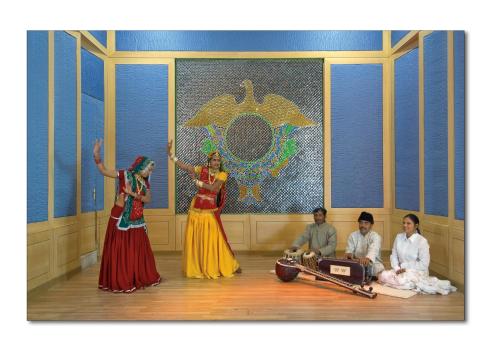 a group of people dancing in a room at Shiv Vilas Resort in Jaipur