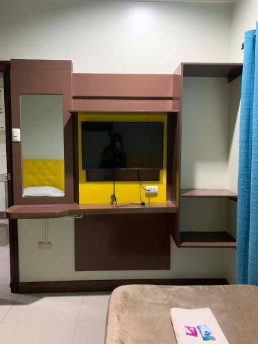 a lego room with a tv in a room at Zion Pension House in Ozamis