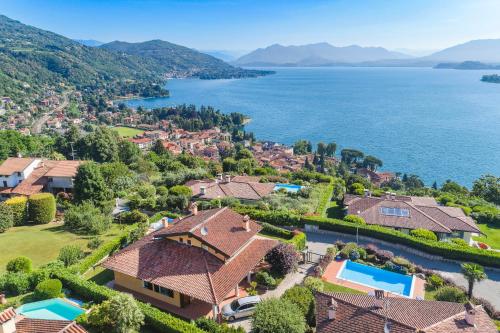 arial view of a house with a lake at Villa Marta in Meina