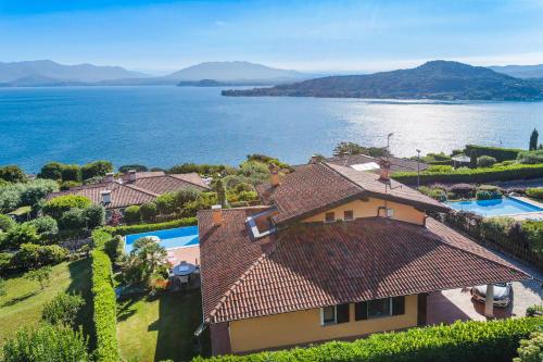 an aerial view of a house and the water at Villa Marta in Meina