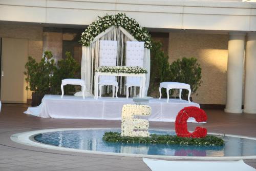 a table with two chairs and a number on it at Buyukhanli Park Hotel in Ankara