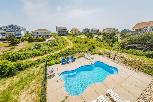 an overhead view of a patio with a swimming pool at Arcadia - Duck, Caffey's Inlet, Ocean Views, 50 Yards to Beach, Pool, Pets OK, Cul-de-sac Location in Duck