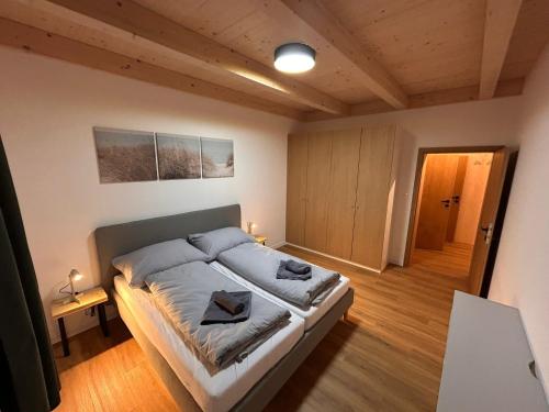 a bedroom with a large bed in a room at Apartmánový dom DK Ateliér in Dolný Kubín