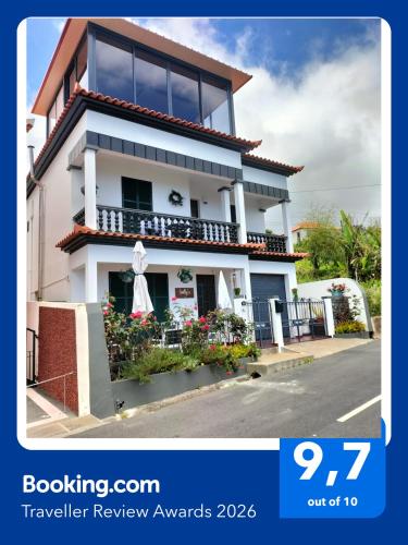 a house on the side of a street at Sallys in Ponta do Sol