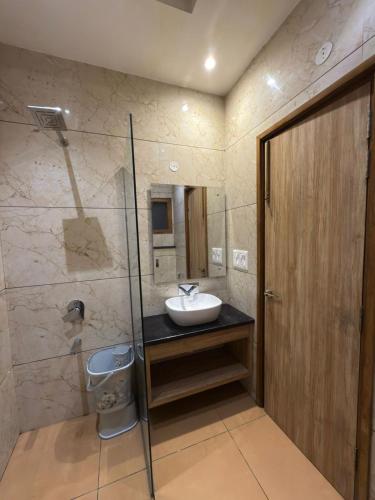 a bathroom with a sink and a shower at Hotel Silver Bricks in Amritsar