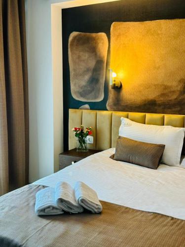 a bedroom with a bed with two books on it at Studio Noa Escape in Saturn