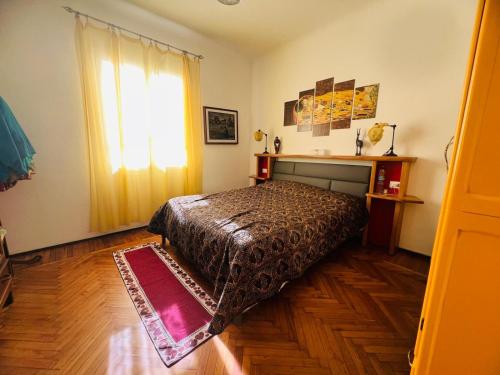 a bedroom with a bed and a window at Suite Semeria 38 - Sanremo in Sanremo