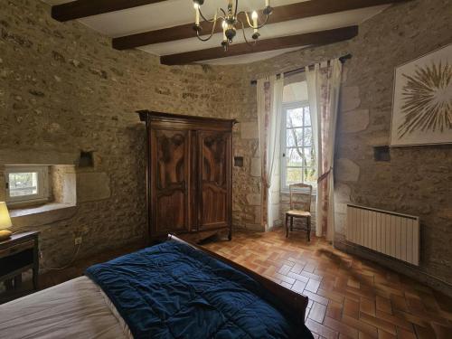 Llit o llits en una habitació de Chateau d'ayron