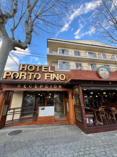 a hotel portipino firm with a sign on a building at Hotel Portofino in Empuriabrava
