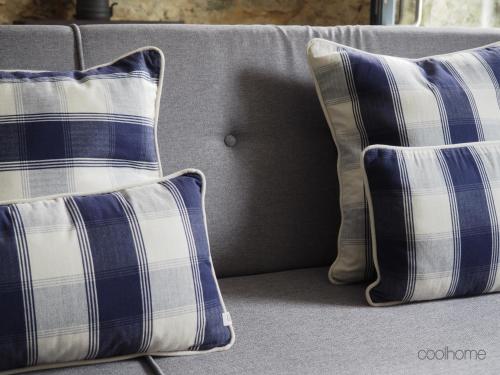 two pillows are sitting on a couch at 12 Casa d'Avó in Albergaria-a-Velha