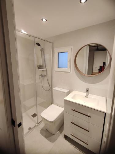 a bathroom with a toilet and a sink and a shower at Apartamento in Arona
