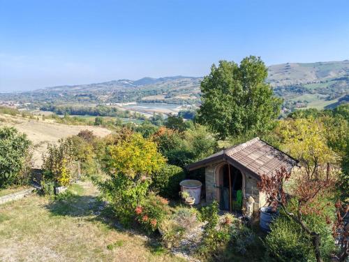 a small house on the side of a hill at B&B 3B Cavriana in San Valentino