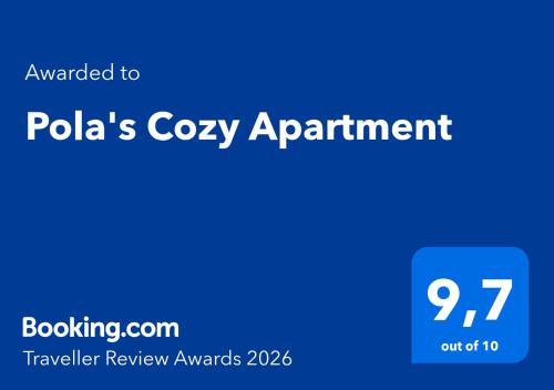 a blue sign that reads polkas cozy appointment at Pola's Cozy Apartment in Thessaloniki