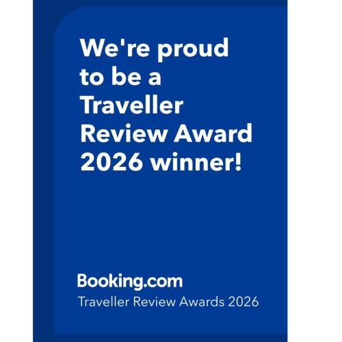a blue sign with the words were proud to be a traveller review award winner at DomCity Apt Near Amsterdam Bikes Included One mile to City Centre in Utrecht