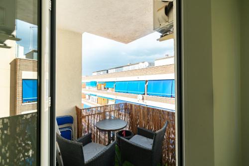 a view from a balcony with a table and chairs at Avenida Principal muy cerca de la playa - By Aloha Palma in Águilas