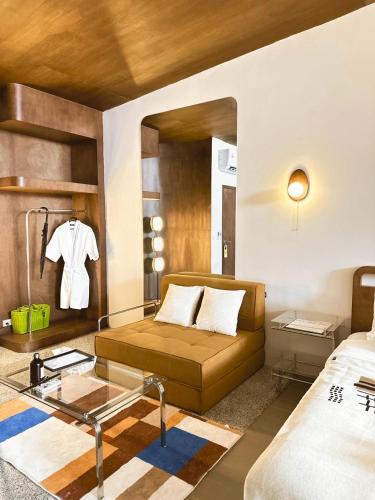 a hotel room with a bed and a mirror at Wanderlust HAUS in Ko Larn