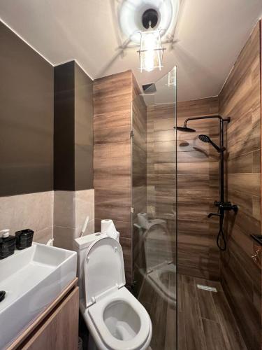 a bathroom with a toilet and a shower and a sink at Nirvana Stays Gudauri in Gudauri