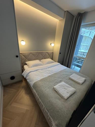 Foto New Cozy Designer Apartment in Uzupis Walk to Old Town in a Luxury Building Garden View Balcony 1