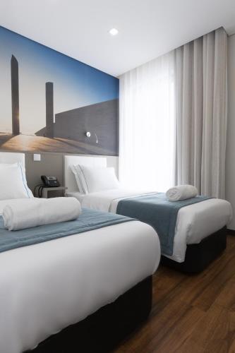 Katil atau katil-katil dalam bilik di Fenicius Charme Hotel