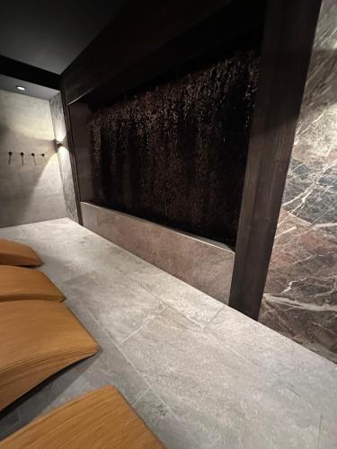 a room with a large window with a stone wall at APT. 539 in Dziwnówek