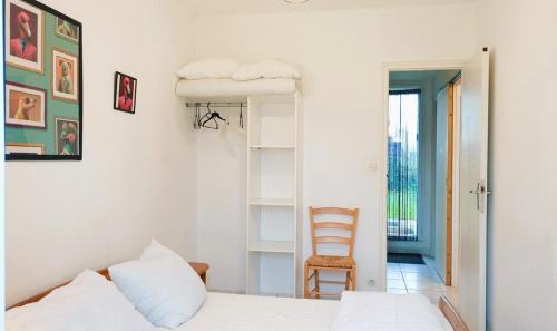 Llit o llits en una habitació de L' Appartement