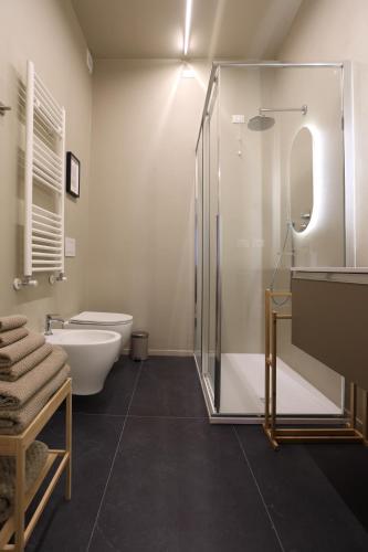 a bathroom with a shower and a toilet and a sink at B&B Il Rifugio Urbano in Pescara