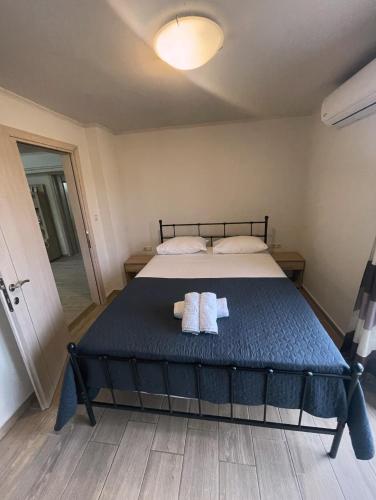 a bedroom with a bed with two towels on it at Villa Oasis 3 in Kalithies