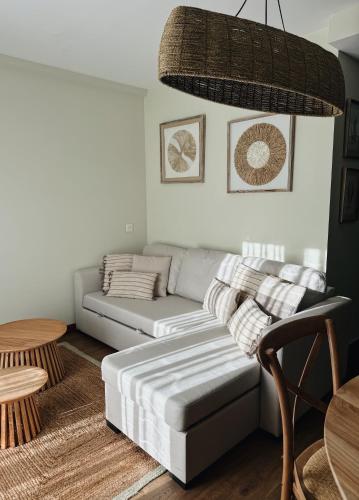 a living room with a couch and a table at El Mirador del Susarón in Puebla de Lillo