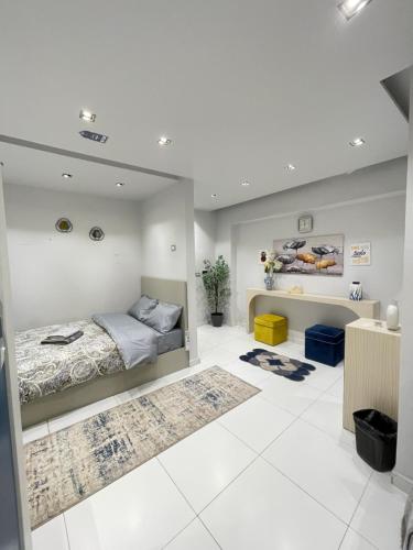 a bedroom with a bed and a desk at Luxury Studio House 589-5 in 6th Of October