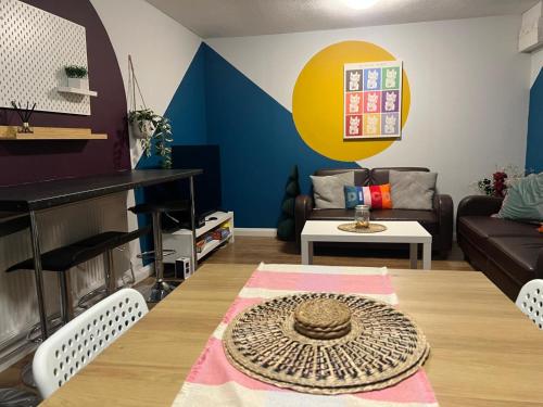 a living room with a couch and a table at 8 person 4 bedroom 4en-suite Free Parking in Warwick