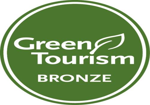 a green tourism logo with a green tourism bronze at Dover Marina Hotel & Spa, Tapestry Collection by Hilton in Dover