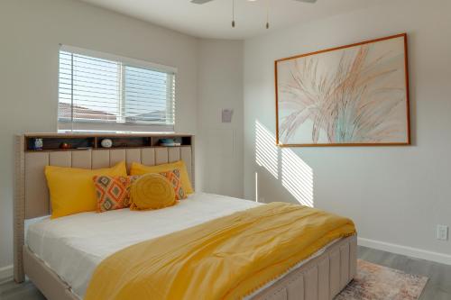 a bedroom with a large bed with yellow pillows at Great for Digital Nomads! Convenient Manteca Apt in Manteca
