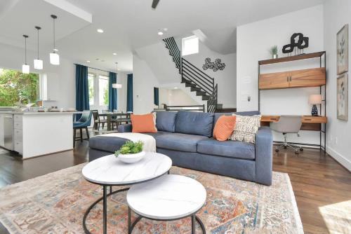 a living room with a couch and a table at Casa LaBella - Downtown Skyline Views - Sleeps 10 in Houston