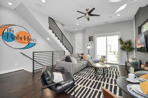 a living room with a couch and a table at Mohr Haus - Walk to NRG Stadium - Medical Center - Sleeps 8 in Houston