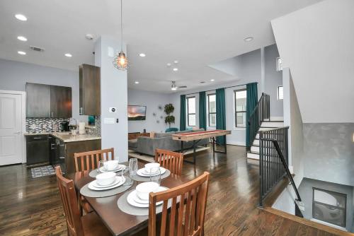 a kitchen and living room with a table and chairs at Skyline Views - Sleeps 10 Home Near Downtown in Houston