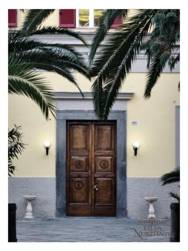 a wooden door on the side of a building at Villa Nunziante Grand Estate, Pompei in Scafati