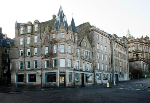 an old building on a street in a city at Motel One Edinburgh-Royal in Edinburgh