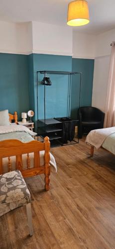 a room with two beds and a glass wall at Sandringham House in Stockton-on-Tees