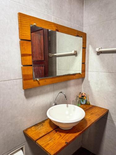 a bathroom with a sink and a mirror at LagoinhaKitePoint in Paraipaba