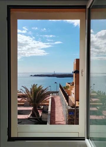 a view of the water from a window at Casa Poris in Poris de Abona