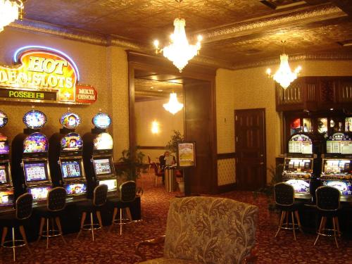 a lobby with a bunch of slot machines at Historic Franklin Hotel in Deadwood