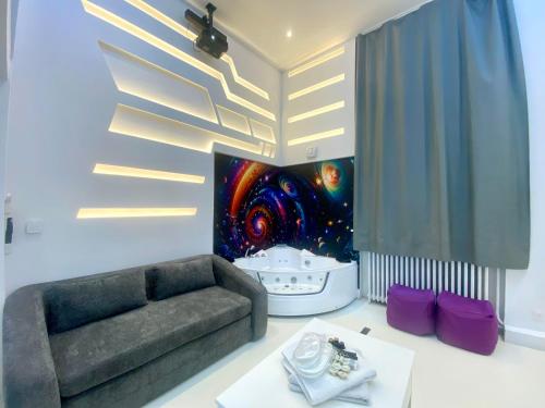 a living room with a couch and a table at Espace-Jacuzzi-Cinema-Nintendo switch in Roubaix