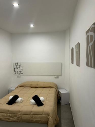 a bedroom with a bed with two pillows on it at MariaValiente in Montoro