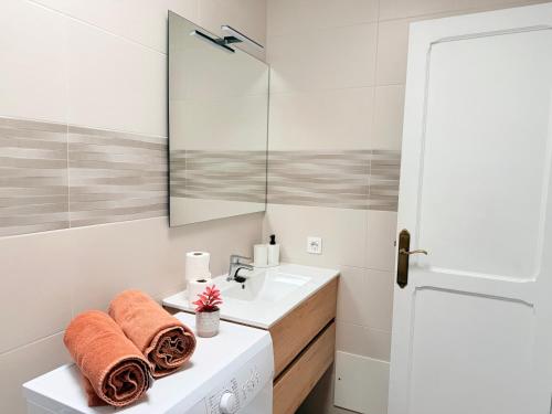 a bathroom with a sink and a mirror at -MONTORIAN View LANZAROTE- in Puerto del Carmen
